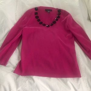 Pink sweater with black jewel detail